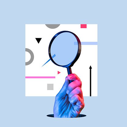 Hand with magnifying glass Representing SEO 